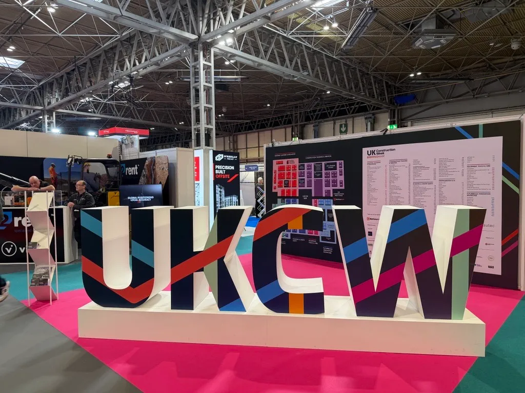 The UKCW letters on the show floor at UK Construction Week 2026, NEC Birmingham